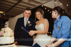 hostess preparing to cut cake