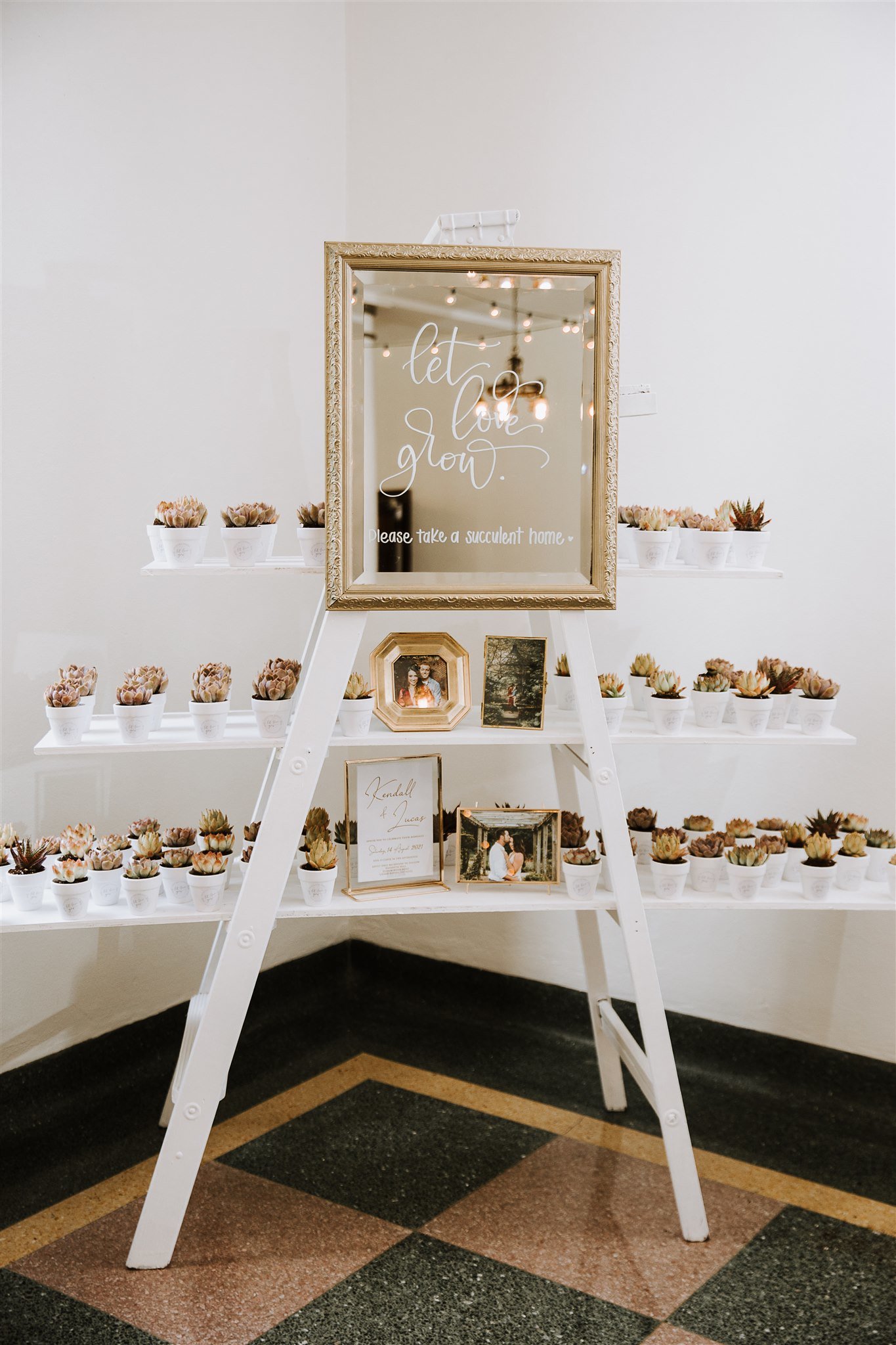 entry into the wedding reception hall with wedding favors on display