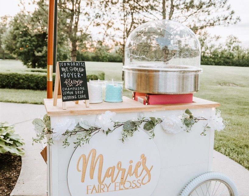 Custom flavored cotton candy machine cart used as an alternative for wedding favors